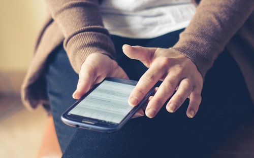 A person using their smartphone
